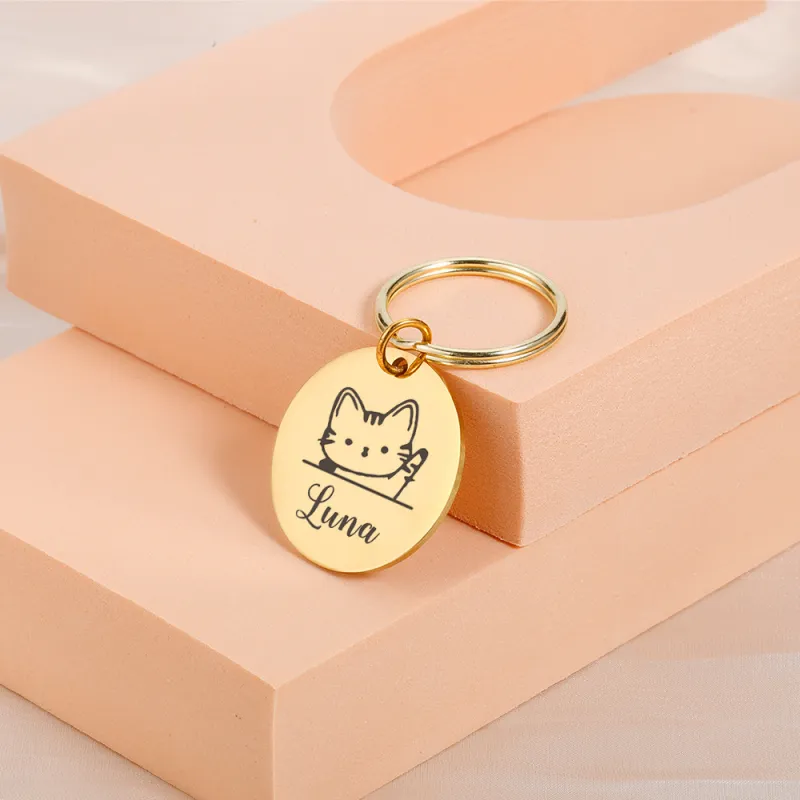 Placa identificativa redonda para mascotas con nombre grabado y número de teléfono